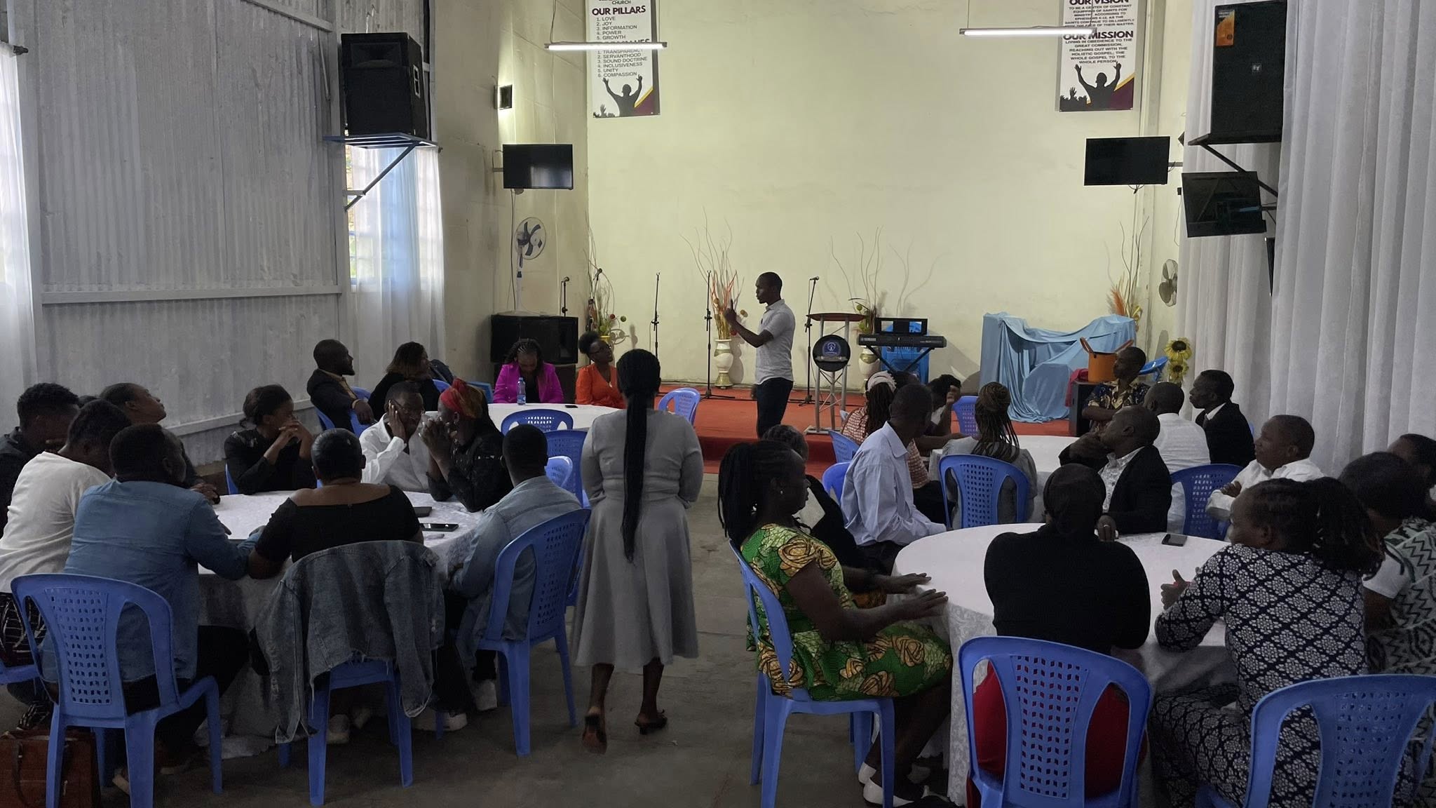 Hands raised during worship service